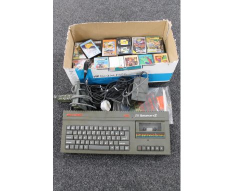 A box of Sinclair 128 KZX Spectrum plus 2 with joy stick, leads, manuals and a quantity of games  