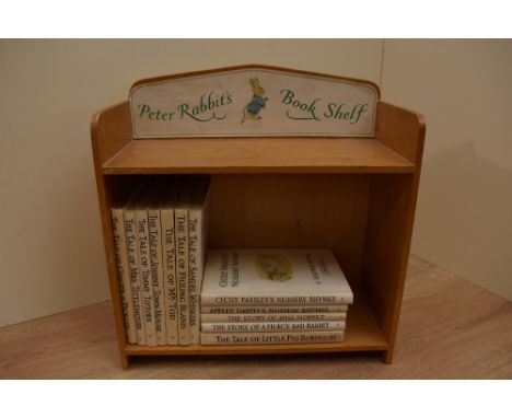 Beatrix Potter. An original 'Peter Rabbit's Book Shelf' display. With 12 contemporary reprint editions of the storybooks in t