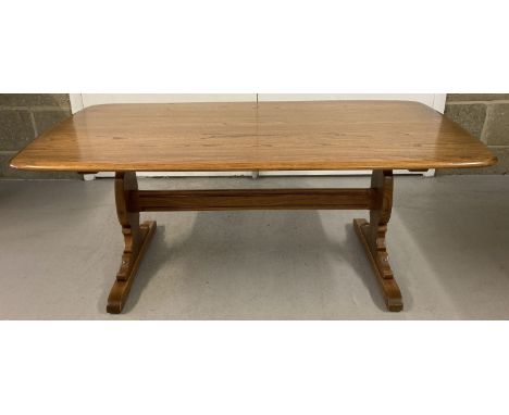 A vintage elm wood Ercol refectory style coffee table.   Approx. 128 x 67 x 50cm tall.