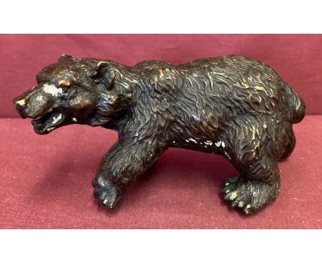 A small bronze figure of a bear.   Approx. 8.5cm x 17cm.