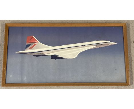 A framed and glazed print of a Concorde turbojet aircraft.   Frame size approx. 32.5cm  x 63cm .