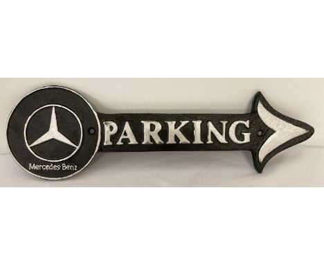 A modern cast iron Mercedes Benz wall hanging plaque in the shape of an arrow.  Black and silver colourway.  Approx. 40cm lon