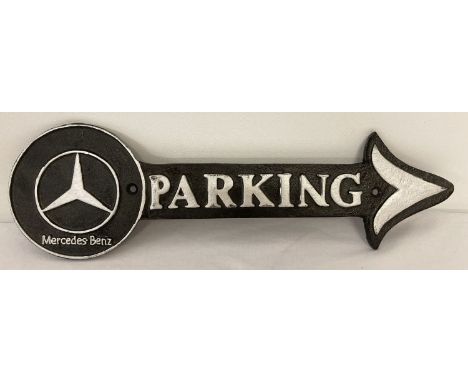 A modern cast iron Mercedes Benz wall hanging plaque in the shape of an arrow.  Black and silver colourway.  Approx. 40cm lon