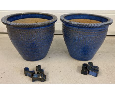 2 large blue glaze ceramic garden planters with lattice detail pattern and 6 ceramic feet.   Approx. 32cm tall x 37cm diamete