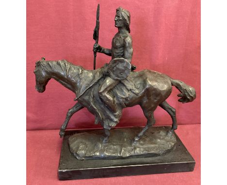 A large bronze figure in the form of a Native American riding a horse.  Mounted on rectangular marble plinth, signed to base.