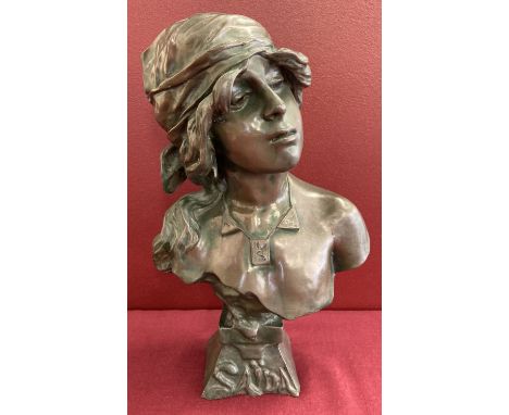 An Art Nouveau style bronze bust of a woman in period dress.   Approx. 28cm tall.