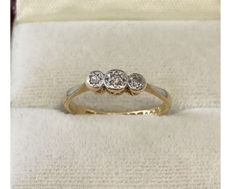 A vintage 18ct gold and platinum diamond set trilogy ring.  Full hallmarks to inside of band.  Ring size M. Total weight appr