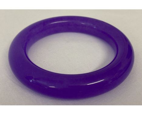 A lavender jade bangle.   Approx. 8.75cm diameter, 6.25cm inner diameter.