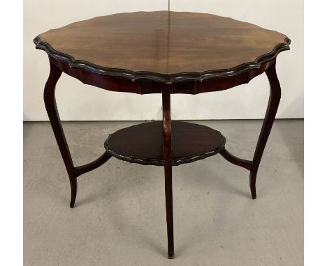 A vintage mahogany oval shaped occasional table with pie crust edge to top and under shelf.   Approx. 70cm tall x 74cm wide.