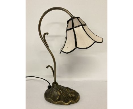 A small Tiffany style table lamp with floral decoration to base.  With cream fluted style, leaded glass light shade.  Approx.