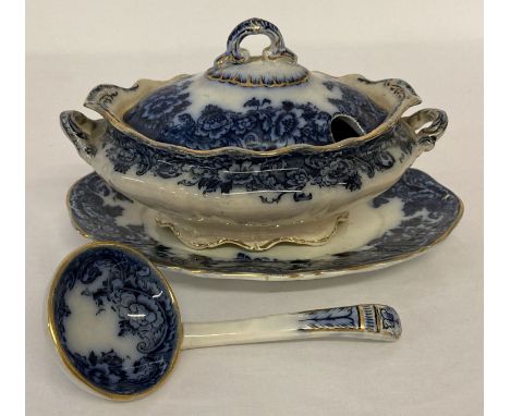 A Victorian "Flourence" pattern blue and white ceramic lidded sauce tureen with gilt detail.  Complete with saucer and ladle.