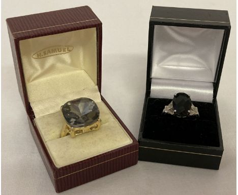 2 dress rings. A 925 silver ring with multi faceted black stone &amp; pierced work detail to mount.  Ring size O½. Together w