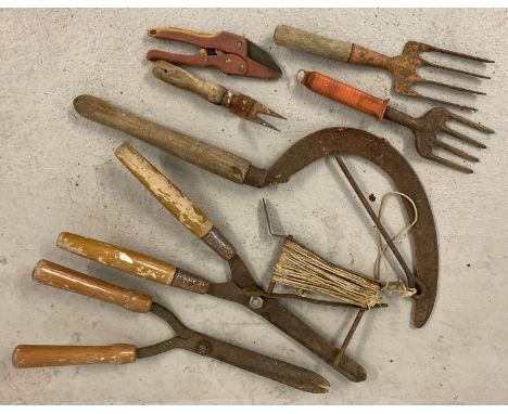 8 vintage hand garden tools. To include shears, hand forks and hand scythe.  