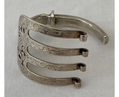 A silver bracelet made from a decorative Victorian serving fish fork.  Hallmarked Arron Hadfield, Sheffield, 1851.  Total wei