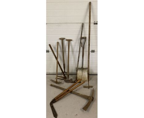 9 vintage garden tools. To include lawn edging shears, a shovel a/f, pick axe and hoe.  