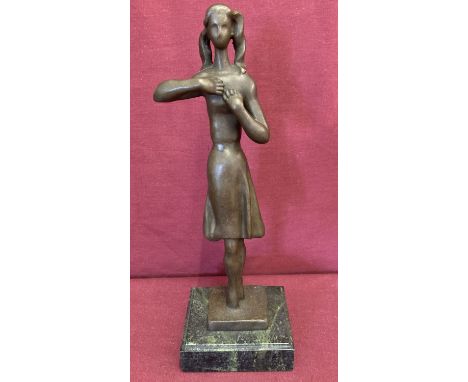 An abstract style bronze figure in the form of a ballerina.  Mounted on a marble plinth, signed to base.  Approx. 32cm tall.