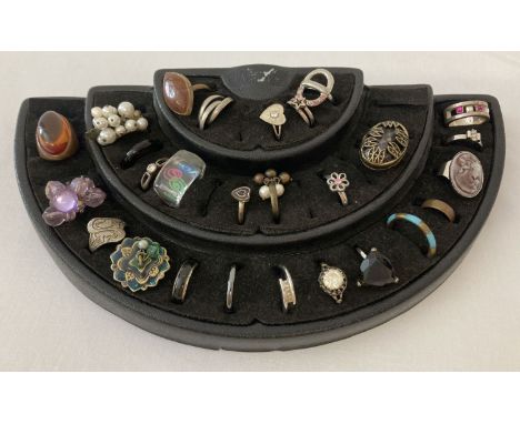 A collection of 28 vintage and modern costume jewellery rings with a ring display stand.  Varying sizes, some adjustable. 