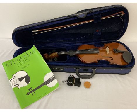 A cased Cathedral VS-00 4/4 wooden bodied children's violin.  Complete with bow, rosin, carrycase with removeable shoulder/ba