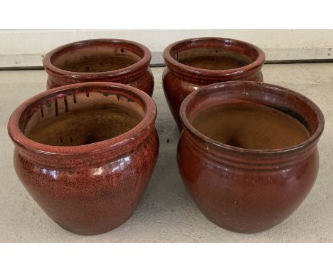 3 matching ceramic garden planters with burgundy and black speckle glaze.  Together with another burgundy glaze ceramic plant