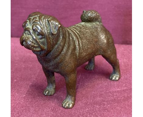 A small bronze figure in the form of a pug dog.  Approx. 6cm tall x 7.5cm long.