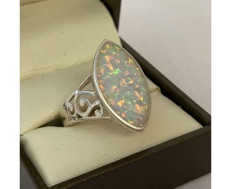 A 925 silver and opalite ring with pierced work detail to shoulders and mount.   Ring size Q.