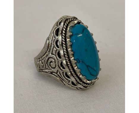 A large white metal and turquoise dress ring.   Ring size W.