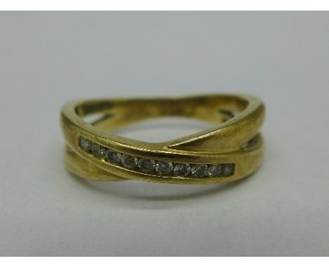 A 9ct gold and diamond ring, 2.1g, K