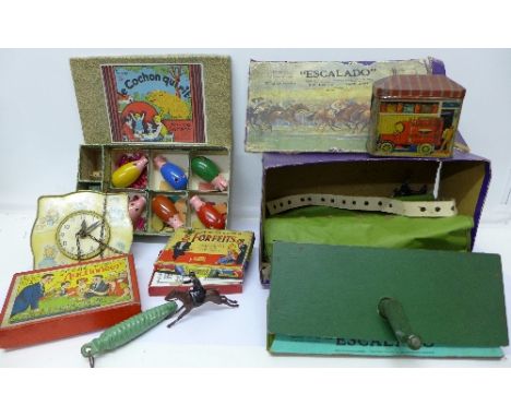 A Chad Valley tin plate Nursery Rhyme clock with weight, early 20th Century toys and games including Escalado and Auctioneer