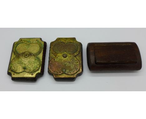 Two brass mounted wooden tablets decorated with snakes and lions and a snuff box