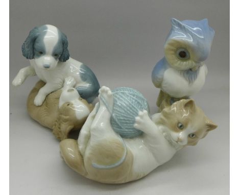 A Nao figure of a cat, a Nao figure of two dogs and a figure of an owl