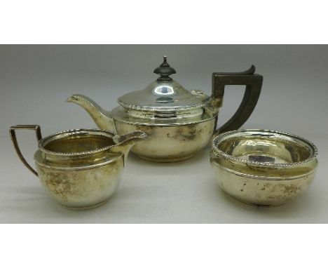 A three piece silver bachelor's tea service, Birmingham 1926, 394g