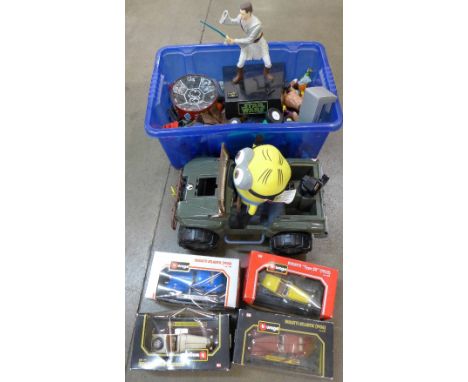 A collection of toys including Action Man jeep, Burago model vehicles, etc.