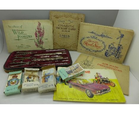 A technical drawing set, cigarette cards including Ogdens, Players, four albums of Wills including Air Raid Precautions, Life