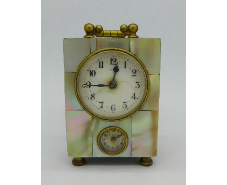 A small mother of pearl cased dual dial alarm clock, dial marked Bavaria, main dial cracked, lacking one piece of mother of p