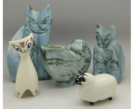 Two Carn pottery cats and a shell, a Wade cat and a model sheep