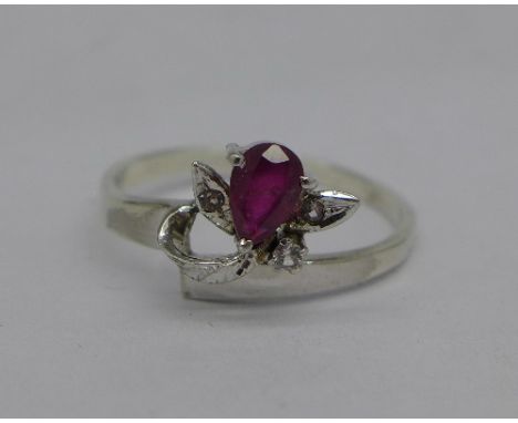 A white metal ring set with a ruby and white stones, 1.9g, Q