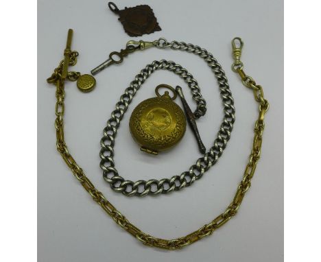 A sovereign case and two Albert chains, one with small compass fob