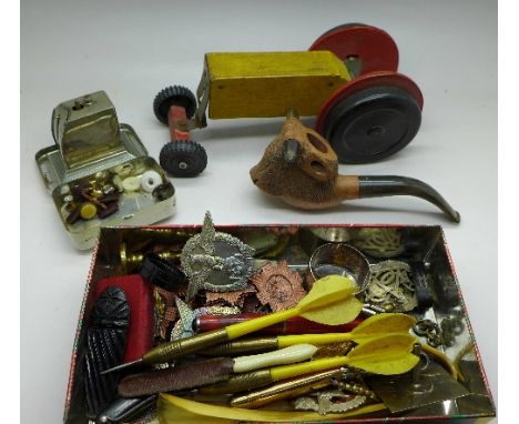 Military badges, cufflinks, mini scales, a wooden Chad Valley tractor and a carved bull shaped pipe
