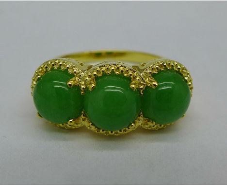 A silver gilt cabochon jade ring