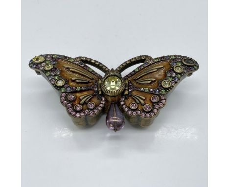 This gorgeous butterfly box is encrusted with crystals and features two dual openings. This item has its original box which m