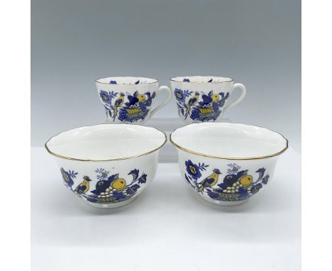 This grouping includes two beautiful coffee cups and matching bowls decorated with birds and fruit in blue and yellow hues, e