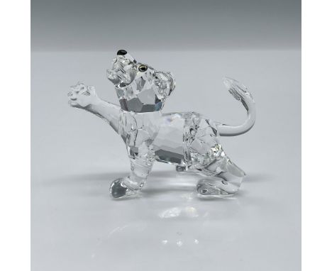 Part of the African Wildlife collection. Lead crystal adorable cub with amber-colored eyes and jet crystal nose. Swarovski et