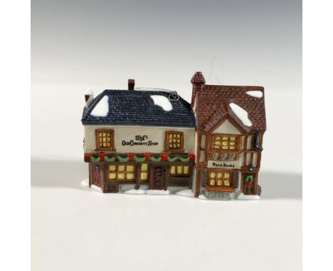 This quaint miniature is a Dickens' Village Ornament collectible by Department 56. Along with its cracked plaster and reveali