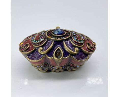 This stunning, jewel-toned Arabian Nights-style box is adorned with polychrome crystals on top between gold toned scrolls. Th