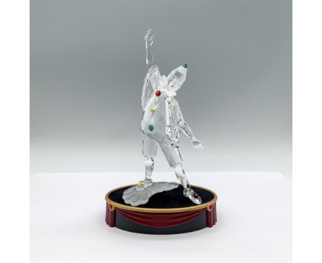 A clear and frosted figure of a clown performing, adorned with colorful pom-poms, blue crystal eyes, and a black tear drop. 1