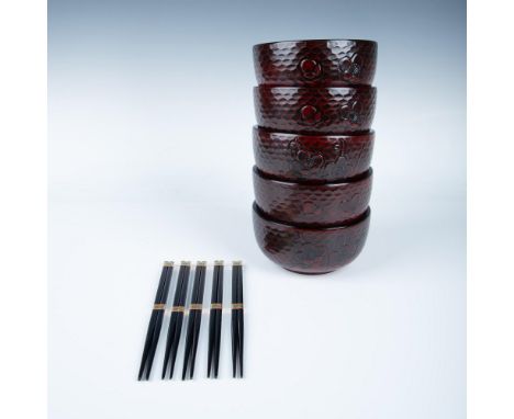 This grouping includes five red lacquer-style rice bowls with a hammered background and poppy flower motif on the exterior. A