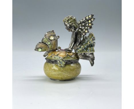 This whimsical, yellow-hued tiny box features a playful fairy and butterfly atop a flower blossom. This item has its original