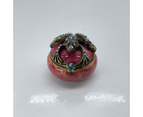 This is a lovely, fuchsia jewel-toned tiny box with a crystal encrusted frog on top. This item has its original box which mea