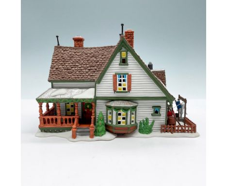 Part of the New England Village Series. Hand-painted porcelain figure featuring a snow laden Farmhouse with porch and yard. L