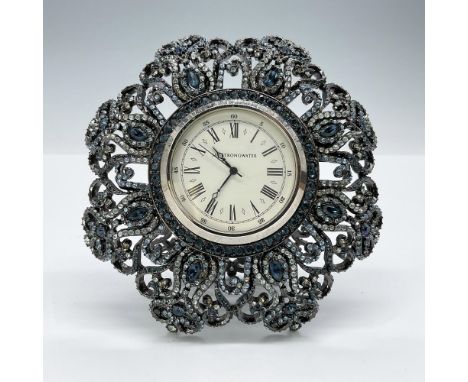 This is a gorgeous blue and black enameled clock embellished with icy-blue hued Swarovski crystals. This item has its origina
